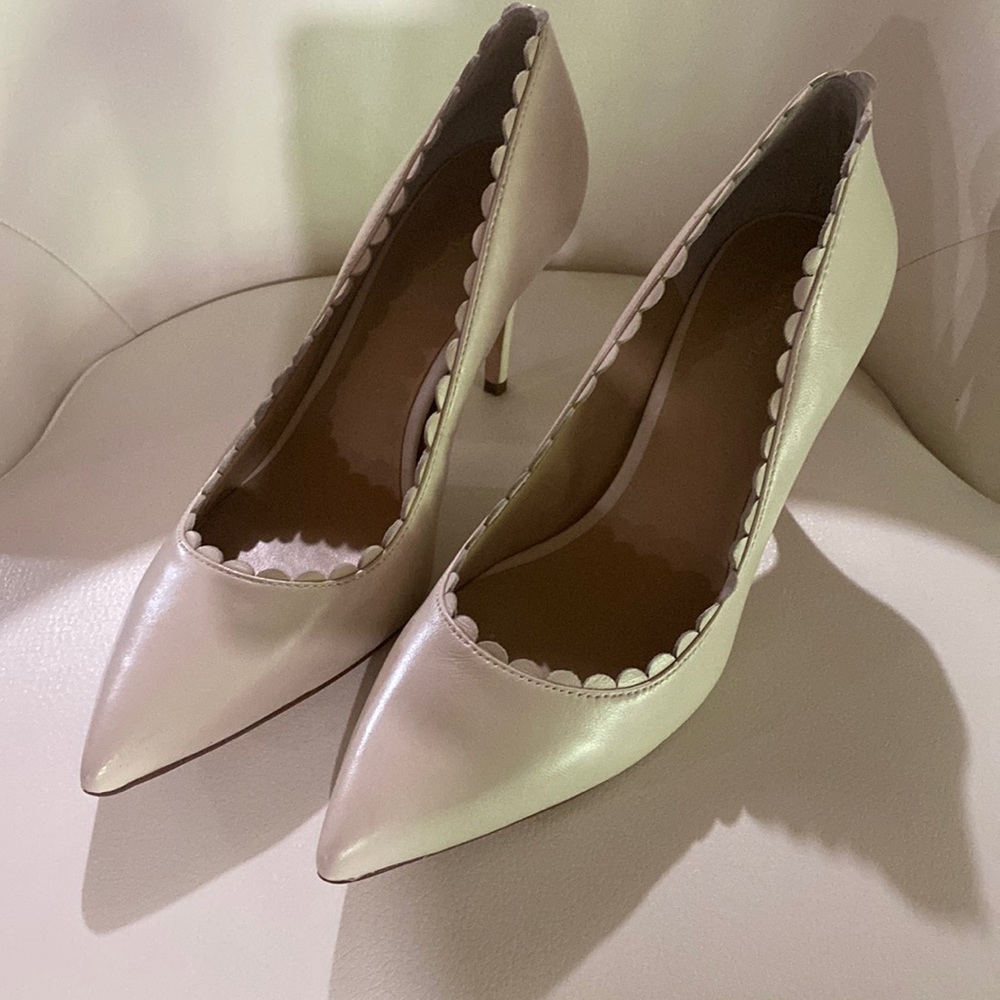 Beautiful Ann Taylor cream pumps with scallop detail.  Worn once!